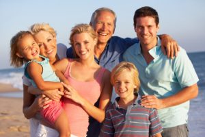 Three Generation Family On Beach Holiday